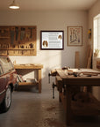 Wooden workshop with tools, workbench, and Cavalier King Charles Spaniel-Heritage History Dog Breed Portrait on the wall.