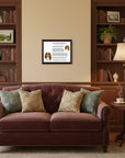 Living room with a brown sofa, bookshelves, and a Cavalier King Charles Spaniel-Heritage History Dog Breed Portrait on the wall.